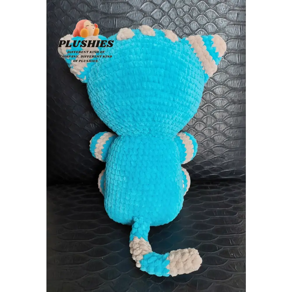 Blue cat stuffed animal with white tail
